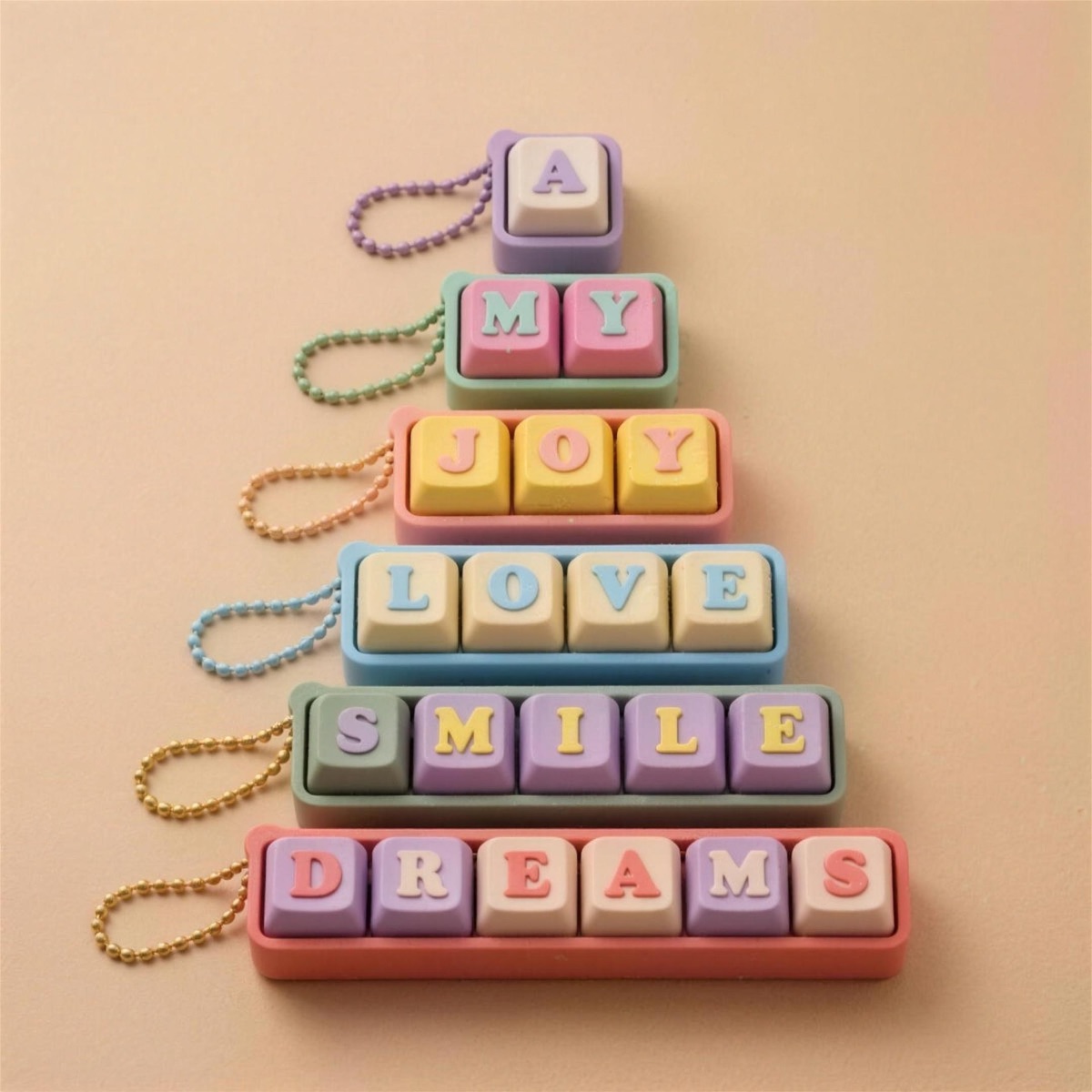 Pastel keycap fidget clickers on keychains