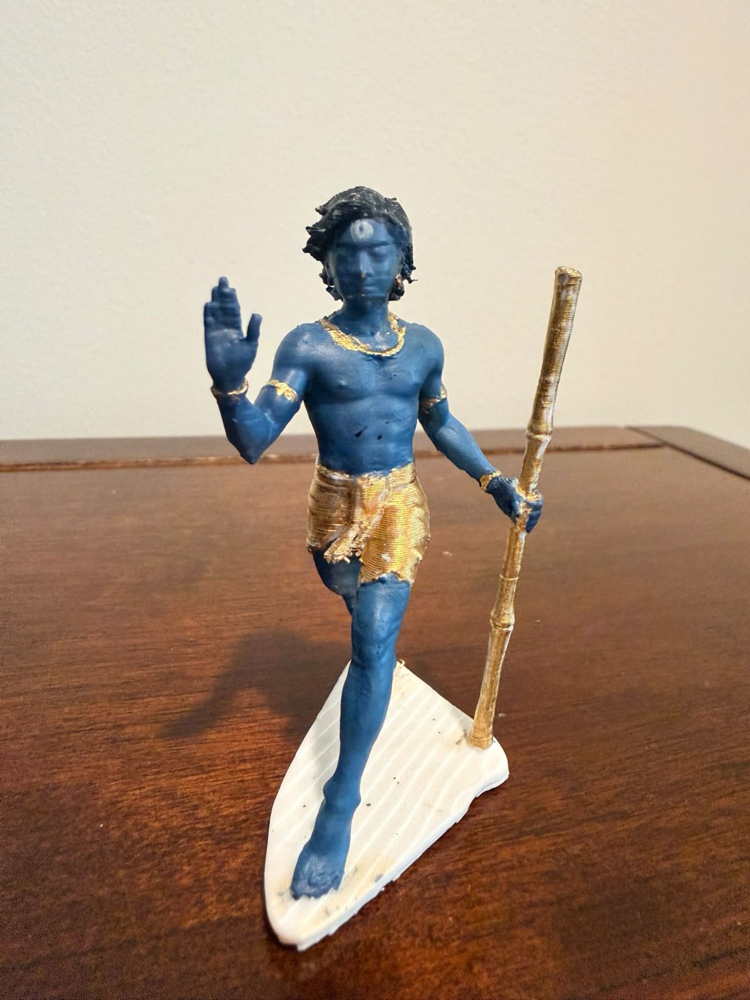 Custom figure in blue with gold details